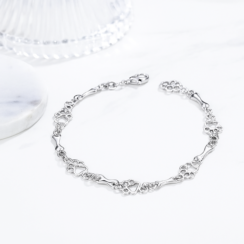Armband met hondenpoot en botbedels van puur zilver